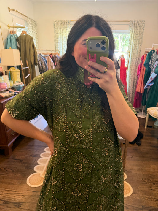 Model taking a close mirror photo in the Green Bandana Midi, showing the dark green bandana print