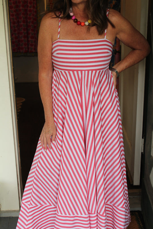 Close view of the Alys Maxi Dress's pink and white stripes and smocked top with thin straps