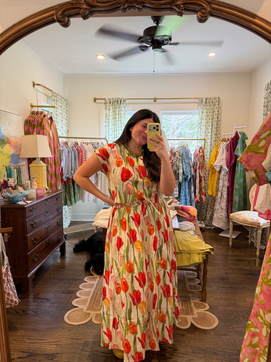 Model taking a mirror photo in the Tulip Set, cream with a red tulip print, full length