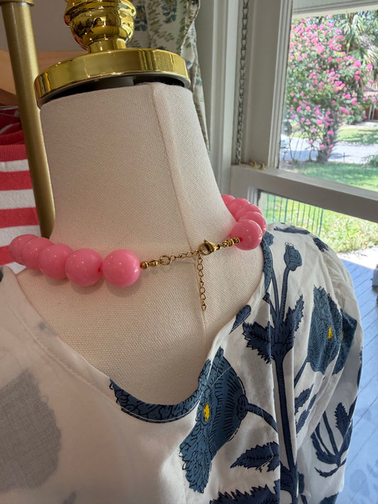 Back view of the Baby Pink Bubble Necklace on a dress form, showing the gold chain