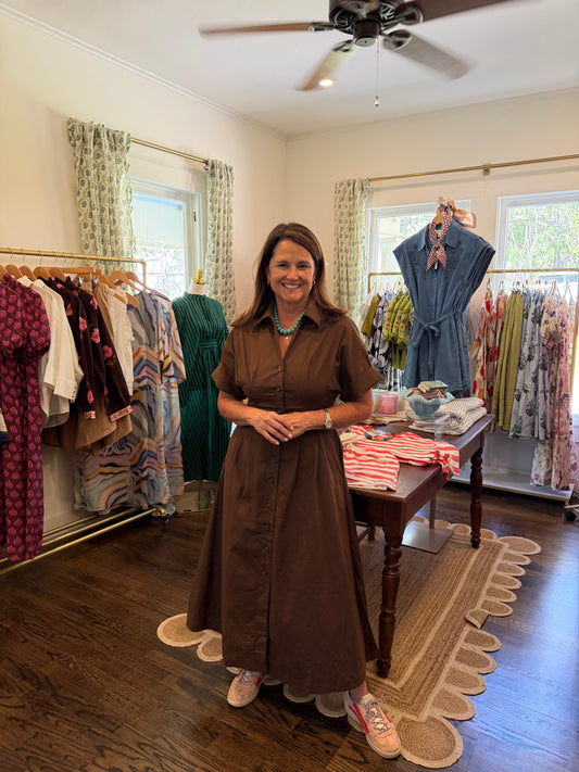 Model wearing the Mack Midi Dress, a brown button down midi, full length in the shop