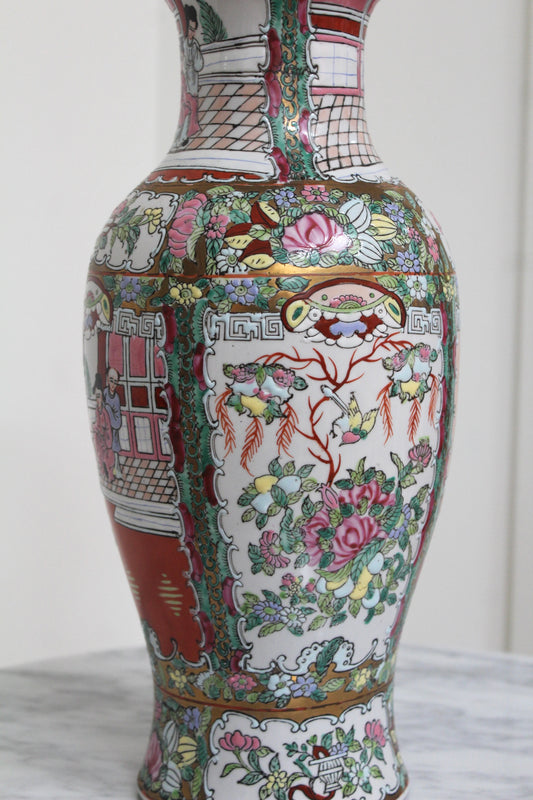 Close view of the Rose Medallion vase's painted panels of flowers, birds and figures