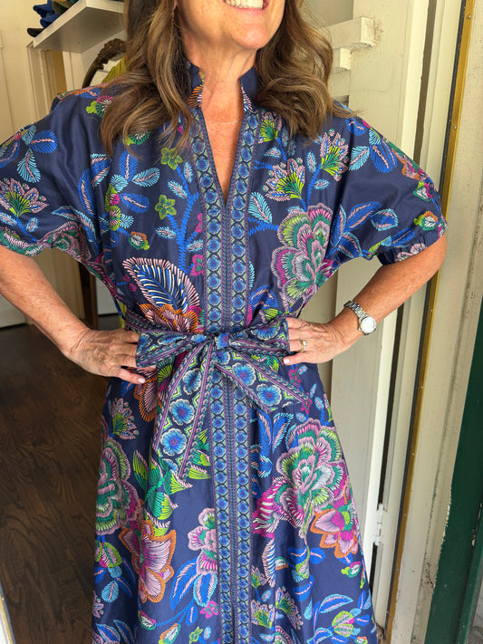 Close view of the Gimme Color Midi Dress's navy floral print, embroidered placket and tie waist