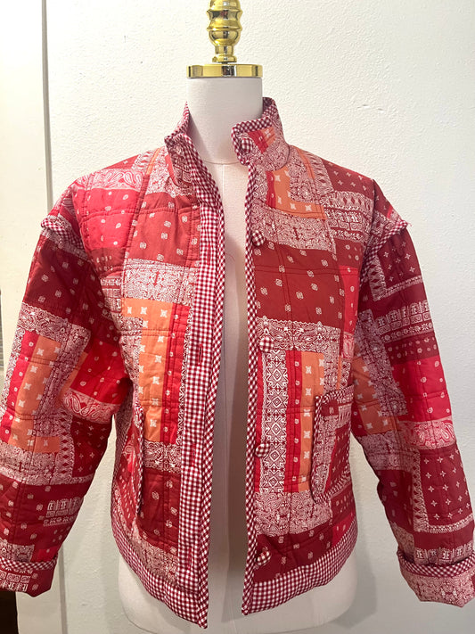 Bandana Jacket on a dress form, a red and cream patchwork bandana print jacket