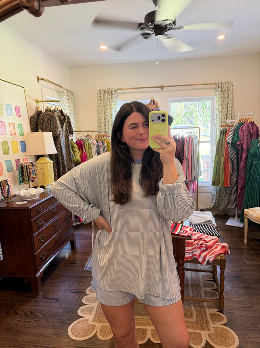 Model taking a mirror photo in the Periwinkle Ribbed Top, a soft stripe top, with matching shorts