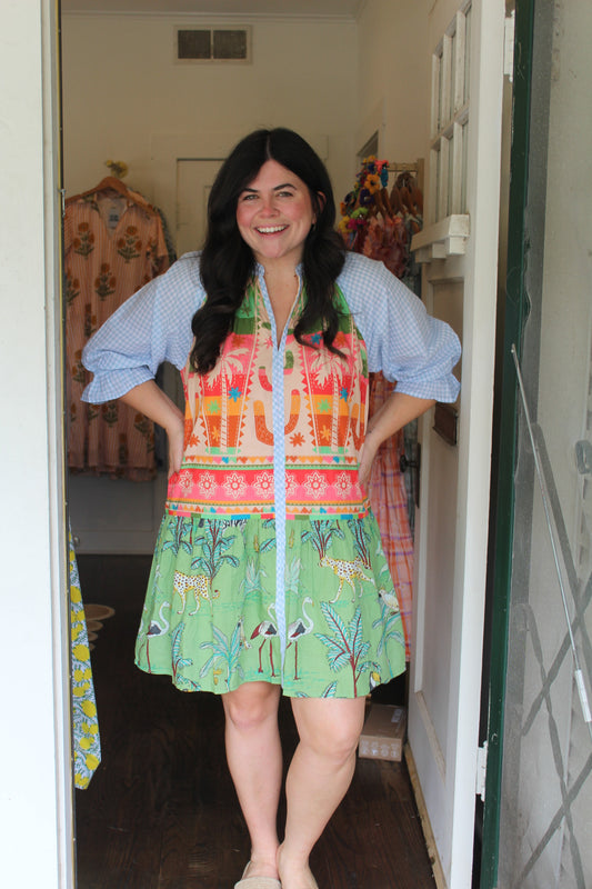 Model wearing the Cactus Mini, a colorful print tiered mini with blue puff sleeves