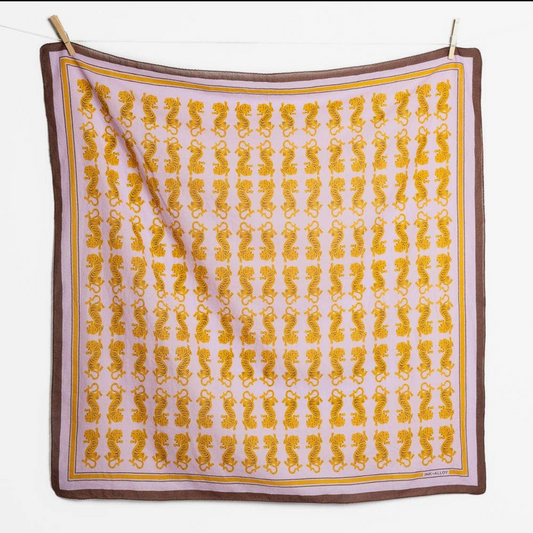 Tiger Scarf hanging flat, a gold tiger pattern on lavender with a brown border