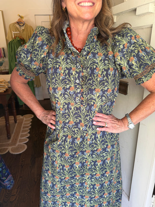 Close view of the Chloe Midi Dress's green and navy floral print and puff sleeves