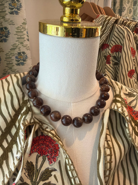 Small Brown Bubble Necklace with dark brown round beads, shown on a dress form