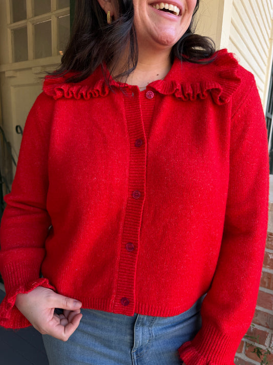 Close view of the Sweetheart Sweater's red knit and oversized ruffle collar