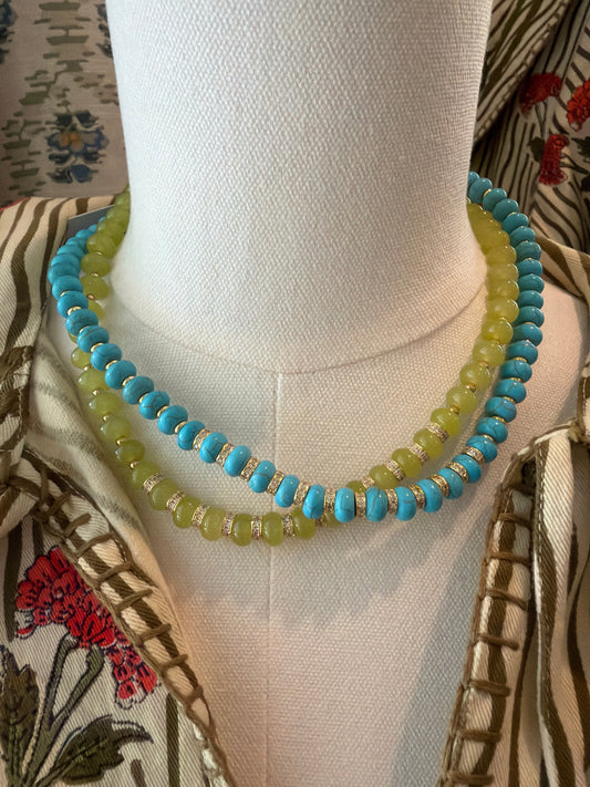Stone Mini Bead Necklaces in turquoise and lime green, layered on a dress form