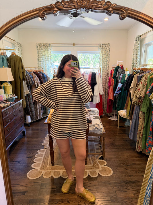 Model taking a mirror photo in the Brown Stripe Set, a stripe top and shorts, full length