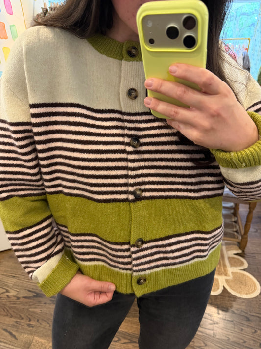 Model taking a close mirror photo in the It-Girl Cardigan, showing the cream, brown stripe and chartreuse band knit