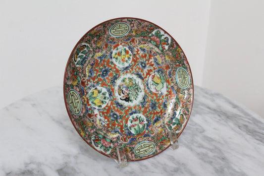 Rose Medallion plate shown in full on a stand on a marble table